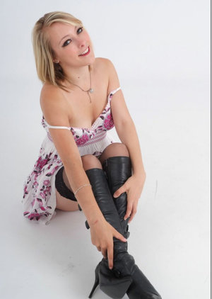 Skanky beauty Sweet Denisa in cowboy boots and denim skirt showing her big tits